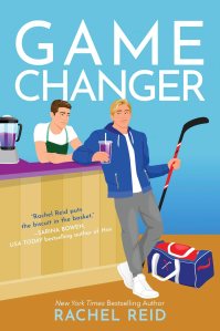 Cover of the book 'Game Changer' by Rachel Reid, featuring a blonde male character in a blue jacket holding a drink, standing next to another character in an apron behind a counter with a blender. A hockey bag is visible on the right.