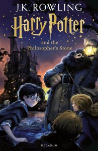 Cover of 'Harry Potter and the Philosopher's Stone' by J.K. Rowling, featuring an illustrated scene with Harry Potter, Hagrid, and the Hogwarts castle at night.