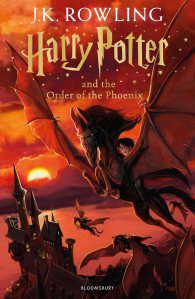 Book cover of 'Harry Potter and the Order of the Phoenix' by J.K. Rowling, featuring a dramatic illustration of a boy riding a winged creature against a sunset backdrop with a castle in the foreground.