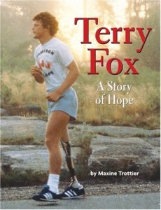 Book cover of 'Terry Fox: A Story of Hope' featuring Terry Fox jogging on a path, wearing a white t-shirt and shorts, with a prosthetic leg.