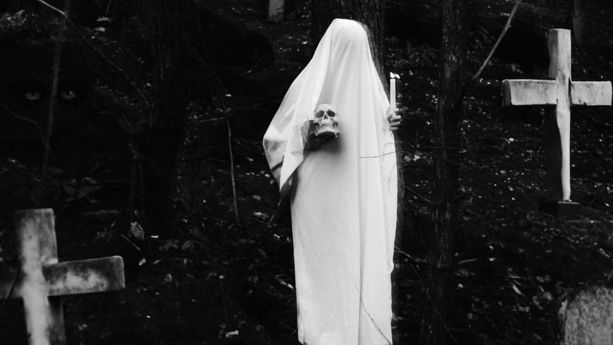 spooky ghost in cemetery